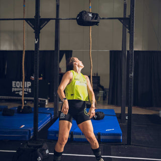 Women throwing an Equip Products Strongman Throw Bag over a target