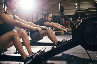 A man and women using the Concept2 Rower in a gym