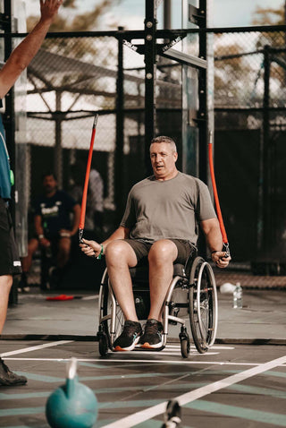 Seated Man Using Multi Ropes