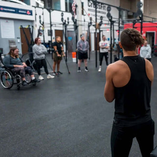 Jenna A PT from Fit To Function meeting with patients/athletes in a gym