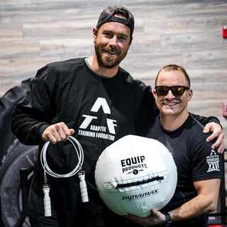 A Visually Impaired Man and another man next to him holding an Equip - Dynamax White Wall ball