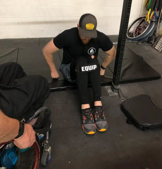 Leg Strap on Wheelchair user working on floor