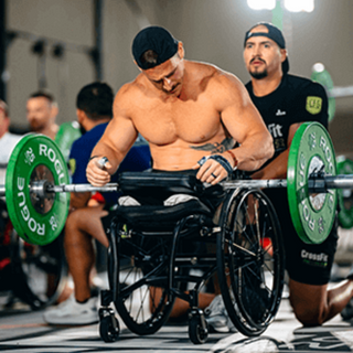 Mike Egan 2024 CrossFit Games With a barbell resting on a LapMat™