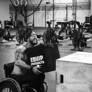Man Lifting The weighted Package to a box