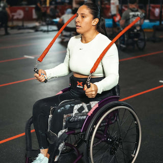 Lady using Multi Ropes in wheelchair in a gym