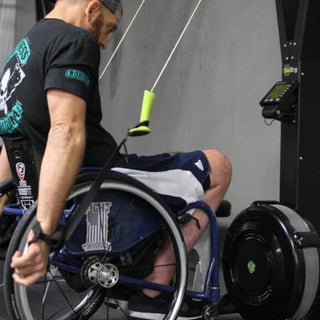 Athlete Chuck Melton using the Equip Ski Erg Extension straps on a Concept2 Ski Erg