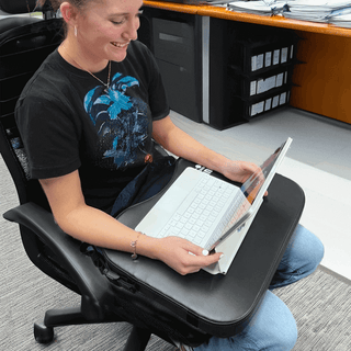 Lady with a lap mat and a computer 