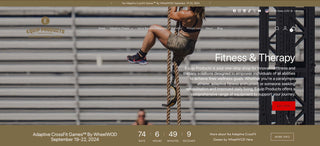 Picture of the front page of the website with Amy Bream hanging from a rope she is climbing, at the CrossFit Games