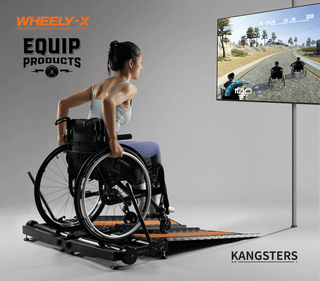 Lady in wheelchair using a Wheely-X watching a TV screen