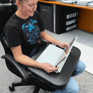 Lady with a lap mat and a computer 