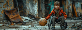 Young boy in wheelchair dribbling a basketball alone on a shady street