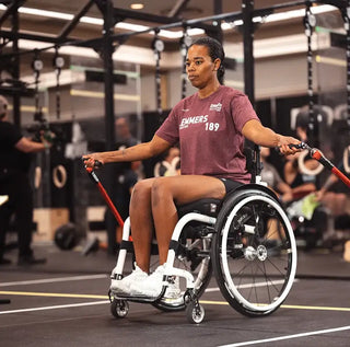 Young lady in a wheelchair using adaptive jump ropes