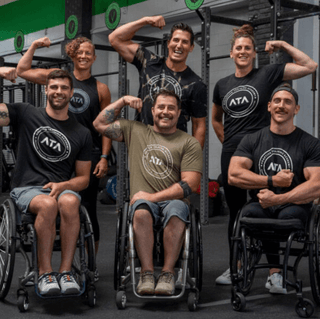 ATA Trainers Flexing Their Muscles in a group picture