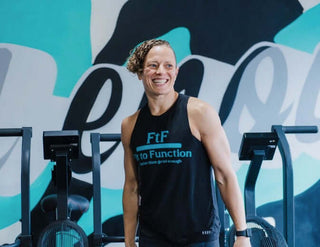 Picture of Jenna Muri-Rosenthal of Fit To Function Recovery standing in her gym.