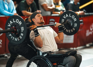 Brandon Mantz and his Wife holding his wheelchair, competing at the 2023 WheelWOD Games in Raleigh, NC