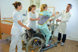 Physical therapy patient with medical staff surrounding her.