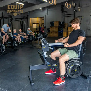 Man on a Concept2 Strength Erg in a gym