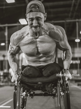 Mike Egan US Marine and Adaptive Athlete in a wheelchair during a competition fully pumped 