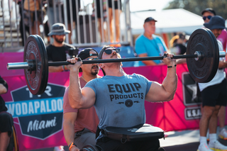 Mike Egen Bi-Lateral Amputee Marine Performing A Barbell Press At WODAPALOOZA 2023