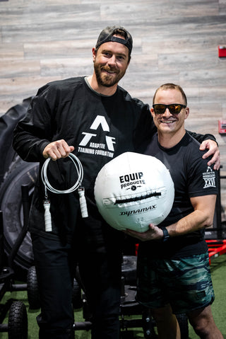 Two Men One Visually Impaired Holding White Wallball and White Jump ropes for High Visibility in the Gym