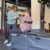 Jenna with Fit To Function Recovery using the Equip Products Body Strap to do assisted sit ups