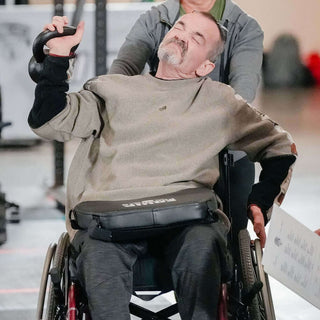 Quad in a WheelChair using a LapMat with Quad Straps at the 2023 WheelWOD Games