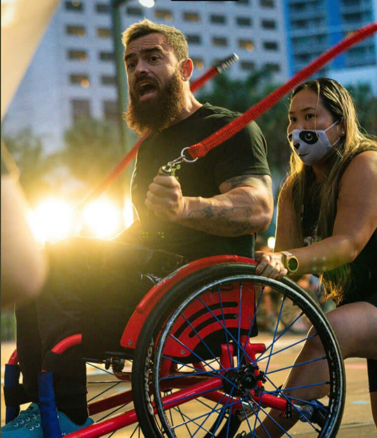 Man in a wheelchair using Multi Ropes™ (Jump Ropes For Seated Athletes.)
