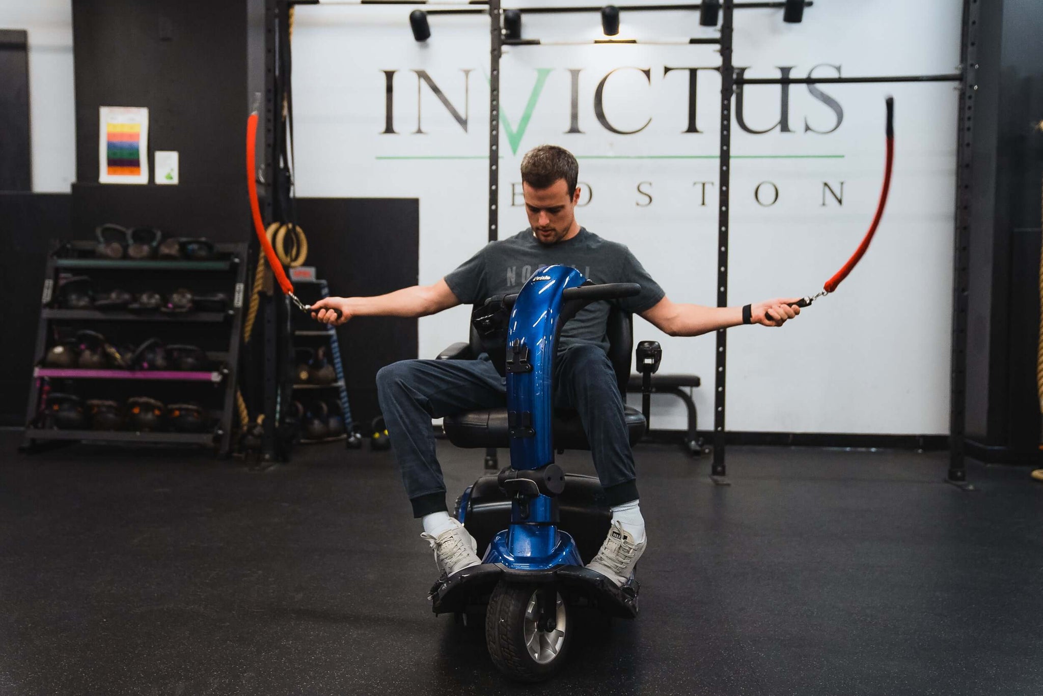 Man in a powered wheelchair using Multi Ropes™ (Jump Ropes For Seated Athletes.)