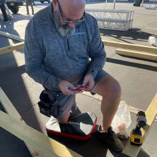 Man kneeling on a HandyMat doing construction
