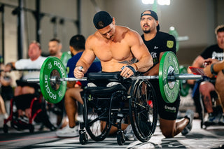 Mike Egan using a LapMat with a barbell and handler behind him