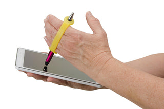 Person using EazyHold Teacher & Therapist 7-Pack yellow cuff grip aid to hold a pen on a tablet screen.