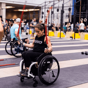 Lady in a wheelchair using Multi Ropes™ (Jump Ropes For Seated Athletes.)