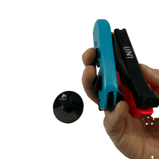 UNI JoyCon Single Hand Adapter for peole who want to game with only one arm. Red and blue controllers in the black stand on a white background Hand holding Joycon different angle