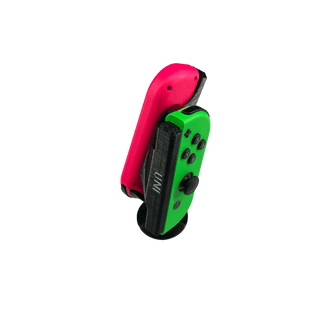 UNI JoyCon Single Hand Adapter for peole who want to game with only one arm. Red and blue controllers in the black stand on a white background top view