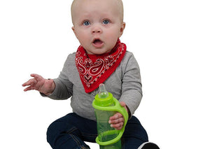 Baby holding an EazyHold Lime sippy cup with a red bandana, showcasing ease of use and comfort.