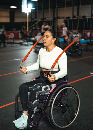 Amalia Ortuno Using Multi Ropes™ sitting in her wheelchair on a competition floor