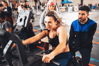 Shauna Cassard from France using the Adaptive Bike Handles on a Rogue Echo Bike during the 2022 WheelWOD Games