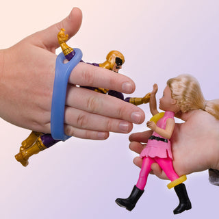 Child using EazyHold Teacher & Therapist 7-Pack universal cuff grip aid with action figures.