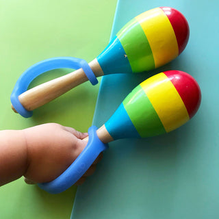 EazyHold Teacher & Therapist 7-Pack universal cuff grip aids used with colorful maracas.
