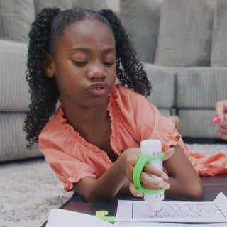 Child using EazyHold Teacher & Therapist 7-Pack grip aid to color, enhancing comfort and control.