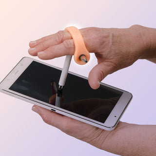 EazyHold Teacher & Therapist 7-Pack universal cuff grip aid used with a stylus on a tablet.