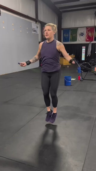 Genny Tidwell, Adaptive Athlete using an Equip Products arm cuff in a gym