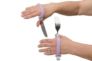 EazyHold Teacher & Therapist 7-Pack with purple cuff grip aids on hands holding utensils.