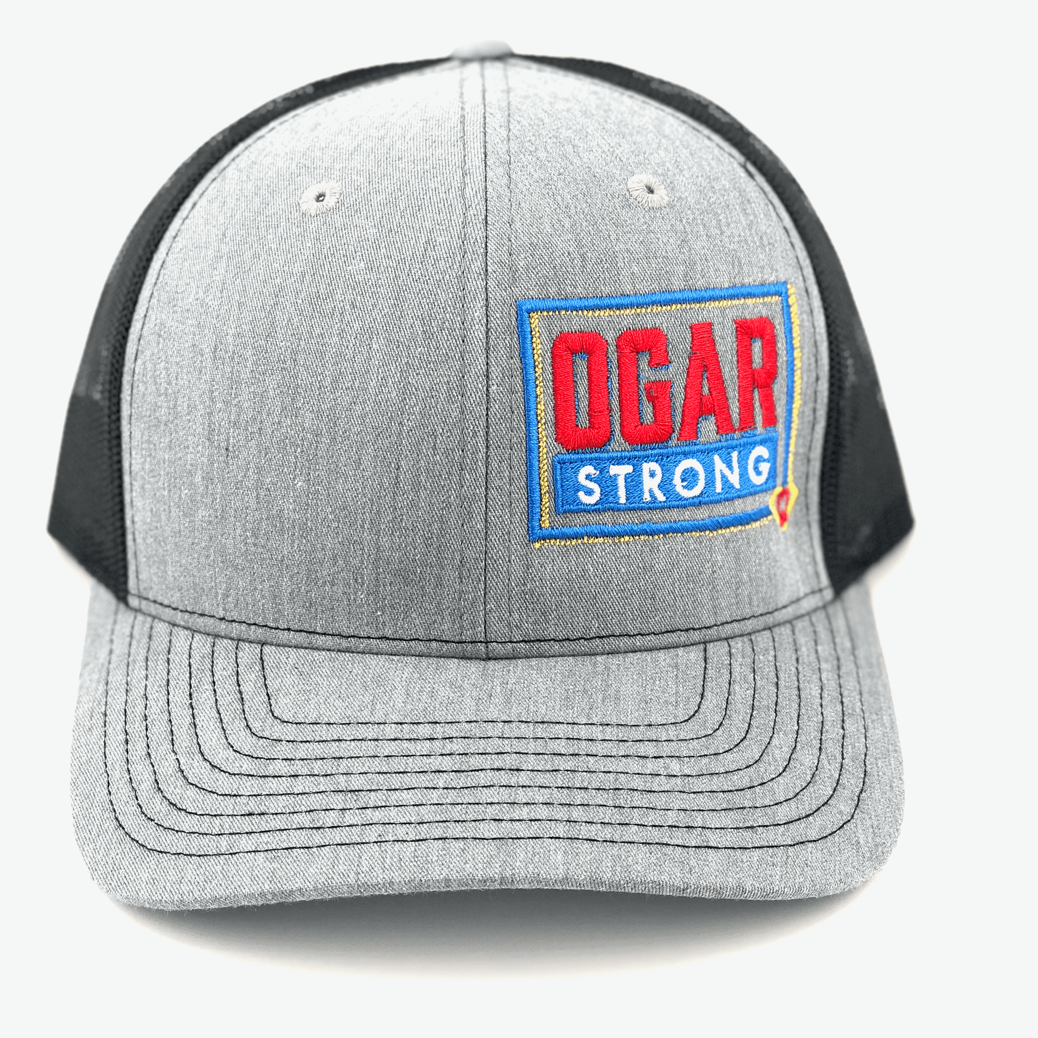 Trucker hat in black mesh - grey front panel with the Ogar Strong Logo embroidered on the front left panel