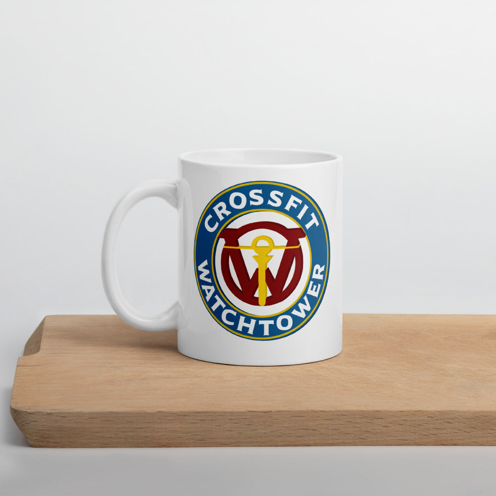 CrossFit Watchtower Coffee Mug sitting on a wood table