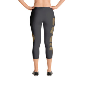 Capri Leggings With Equip Products Down one leg and the bumper plate Equip Logo on the other leg facing away